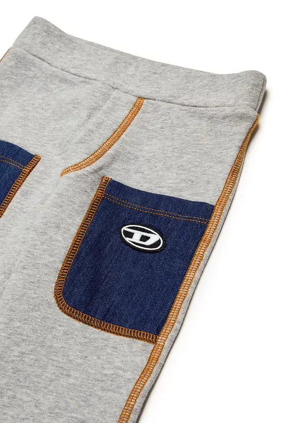 Trousers with denim pockets