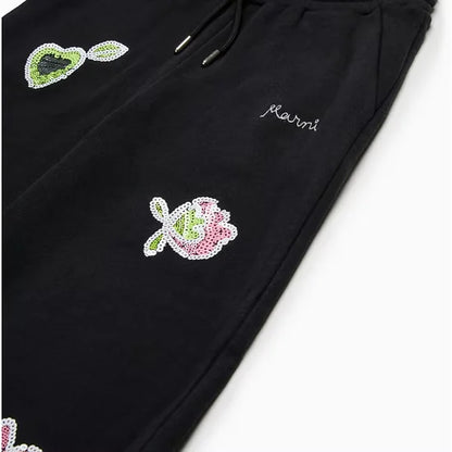 Wide trousers with sequined flowers